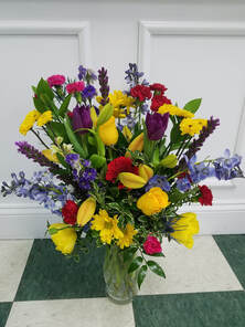 Purple daisies, iris, delphinium and sunflower bouquetPicture